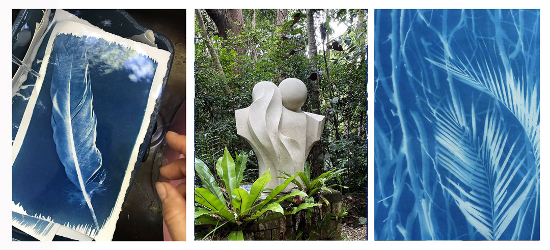 Deep blue image of a feather, a stone sculpture in a forest, a blue image of twigs and palm leave, a cyanotype